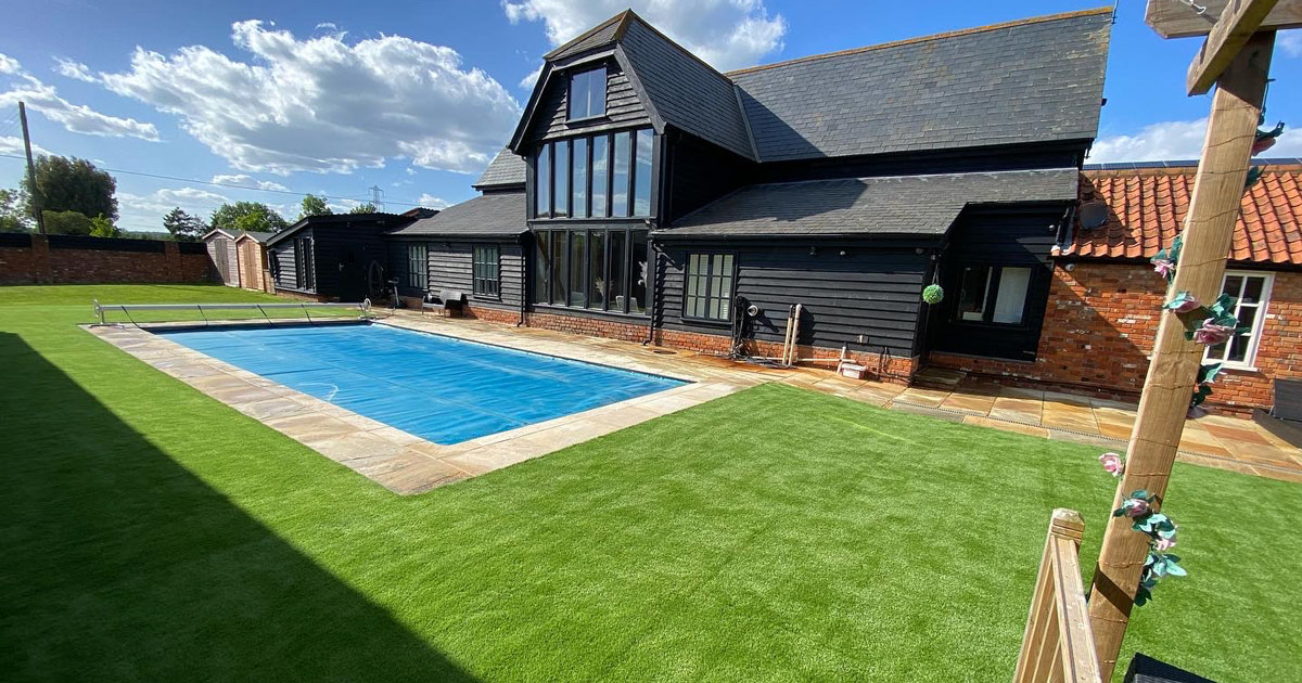 Cold Norton artificial grass installation around swimming pool