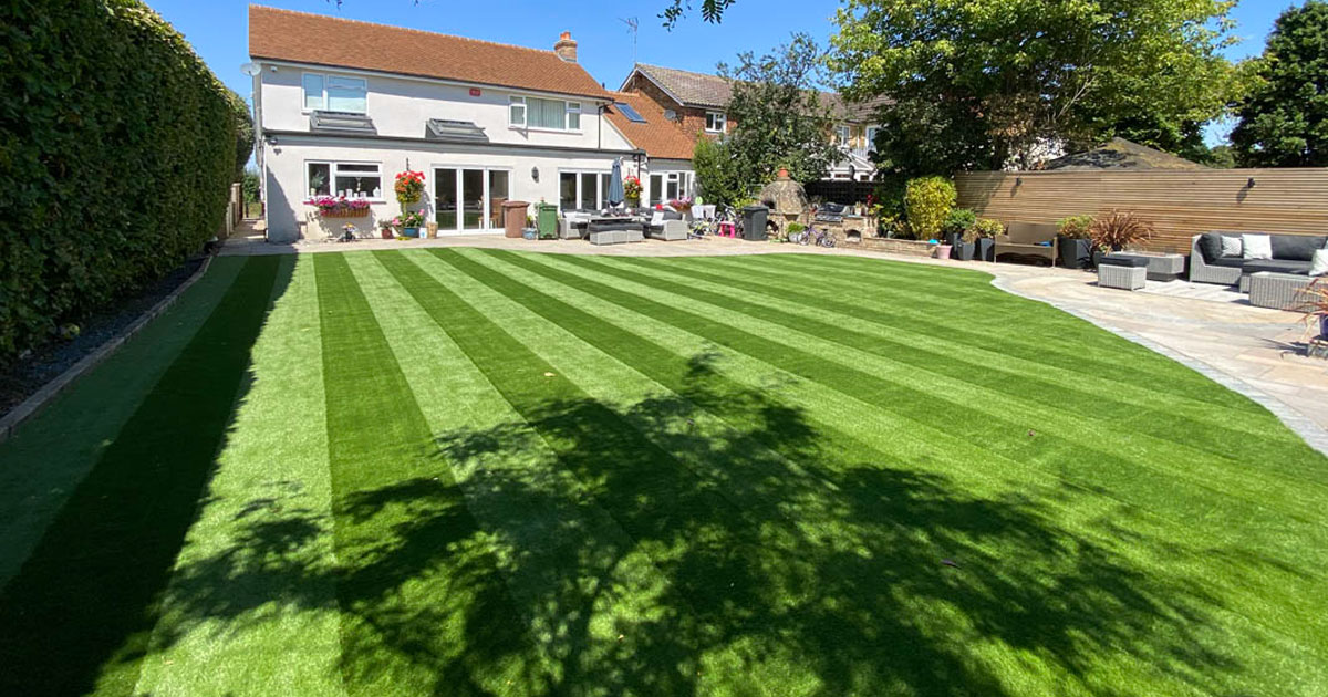 Brentwood striped artificial lawn around swimming pool